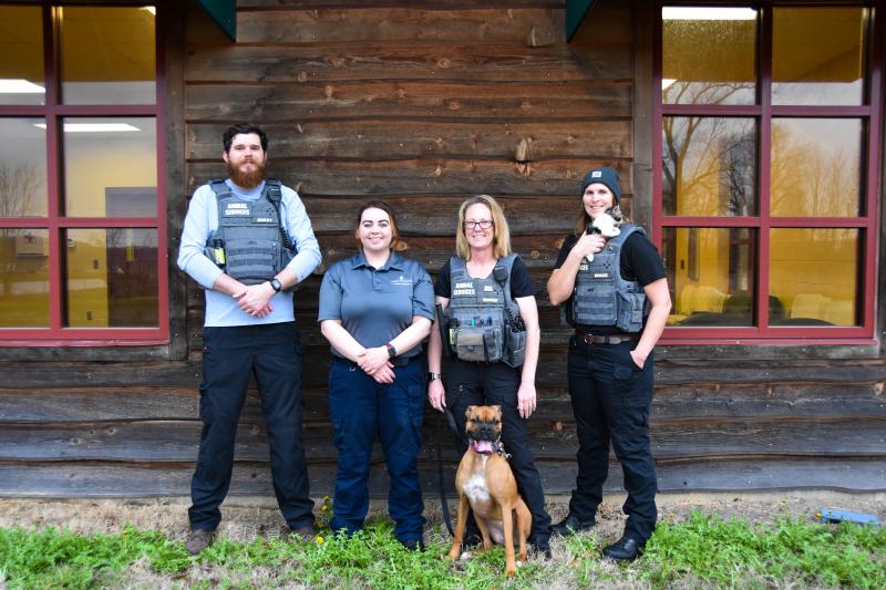 Animal services officers outside of shelter